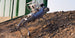 Unitree B2-XJ2-B inspection robot with protective roll cage, dual-light PTZ camera and LiDAR climbing a rubble slope