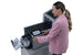 Office worker operating the Intimus TSI-4G folder inserter