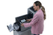 Office worker operating the Intimus TSI-4G folder inserter