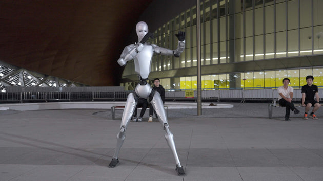 Unitree H2 EDU Humanoid Robot in a dynamic wide-stance pose, full-body outdoor action shot