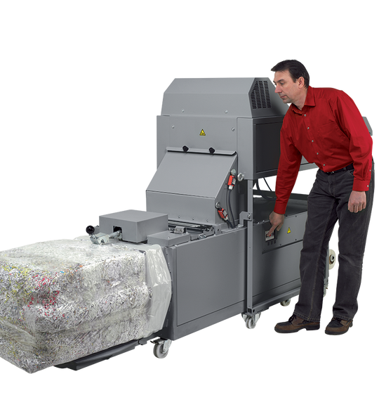 Compressed paper bale ejected from the Intimus 870 baler