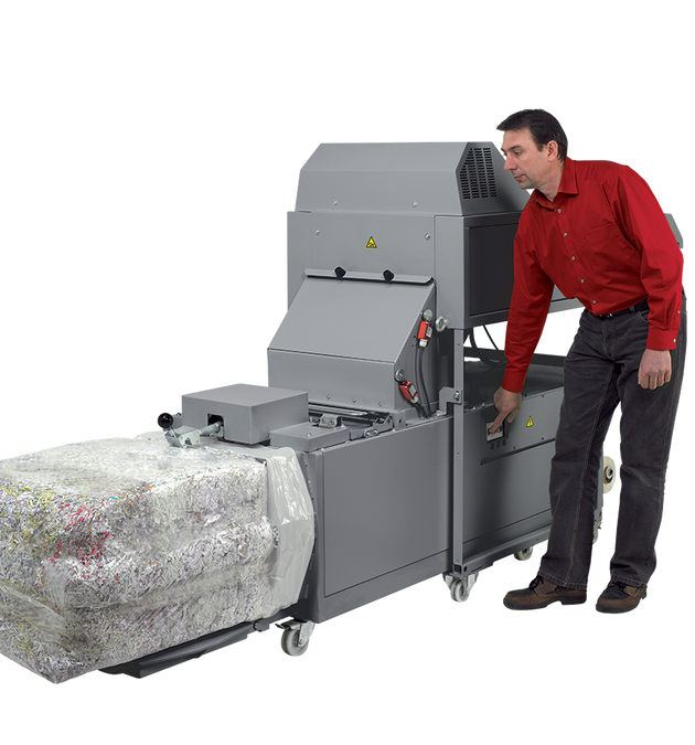 Compressed paper bale ejected from the Intimus 870 baler