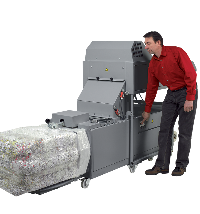 Compressed paper bale ejected from the Intimus 870 baler