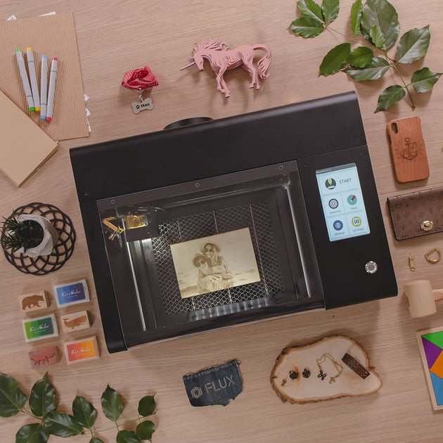 FLUX beamo compact laser cutter on a desk showing its small footprint