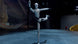 Unitree H2 Humanoid Robot performing a dynamic balance pose on stage, full-body action shot