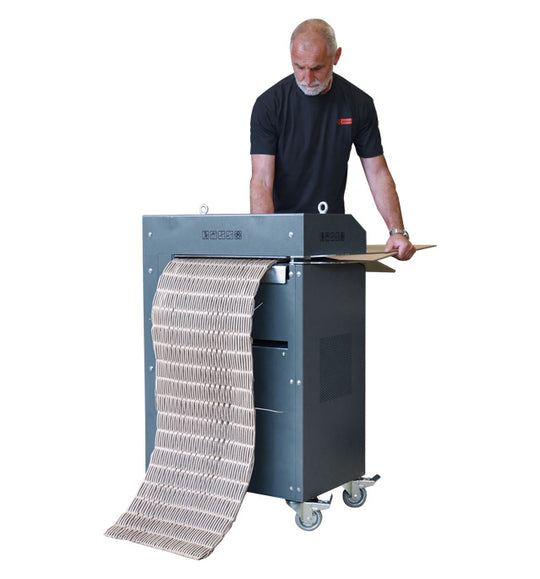 Operator feeding corrugated cardboard into Intimus PacMaster S