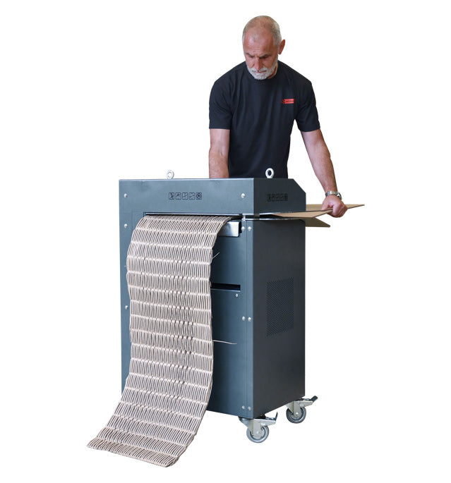 Operator feeding corrugated cardboard into Intimus PacMaster S